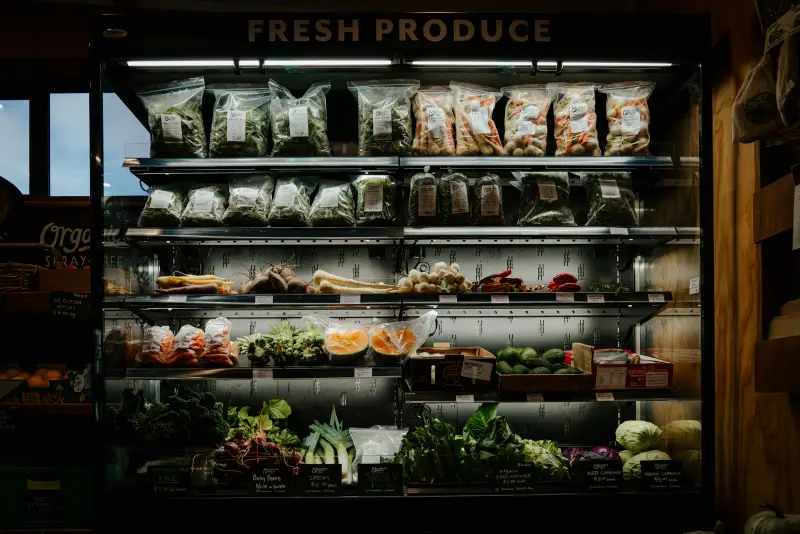 The fresh produce cabinet in the Mangaroa Farm Shop, stocked with greens and vegetables from the garden